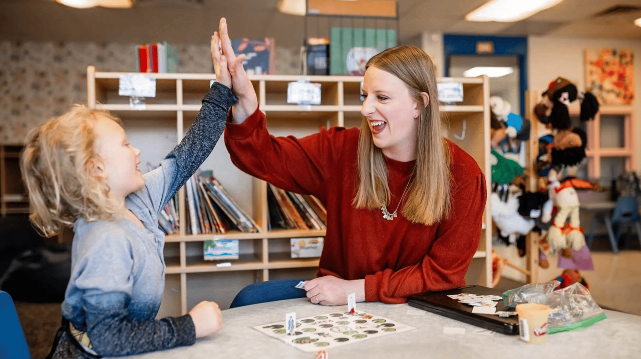 Speech, Language, Hearing Sciences student Abby Marroon plays an articulation game with Monty Manley, 4, at the Auraria Early Learning Center. Photo by Alyson McClaran