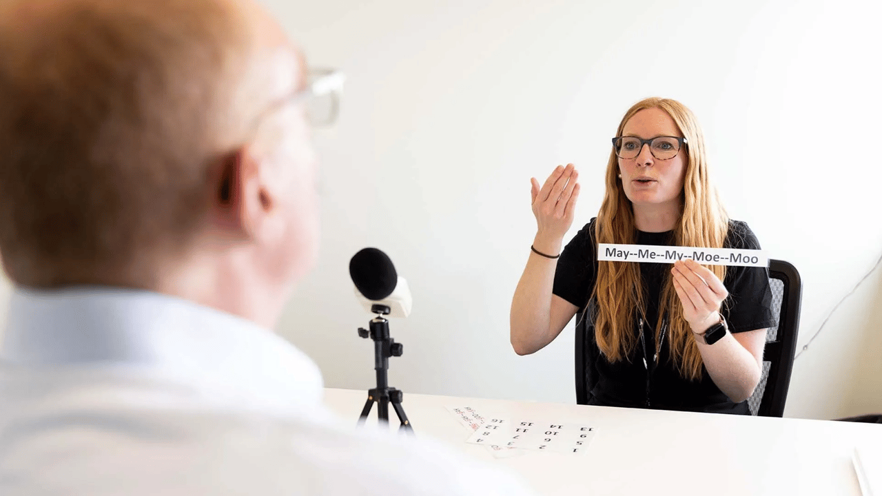 Taylor Hare, a master’s student in Speech-Language Pathology at MSU Denver, works with Parkinson's patient Steve Galpern. Photo by Amanda Schwengel