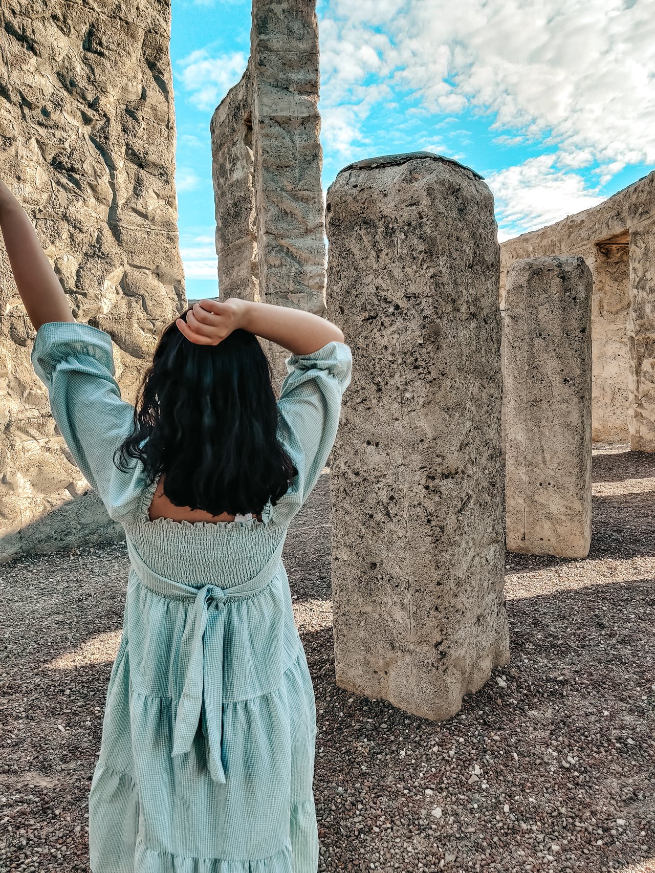 Woman in front of complete Stongehenge Replica