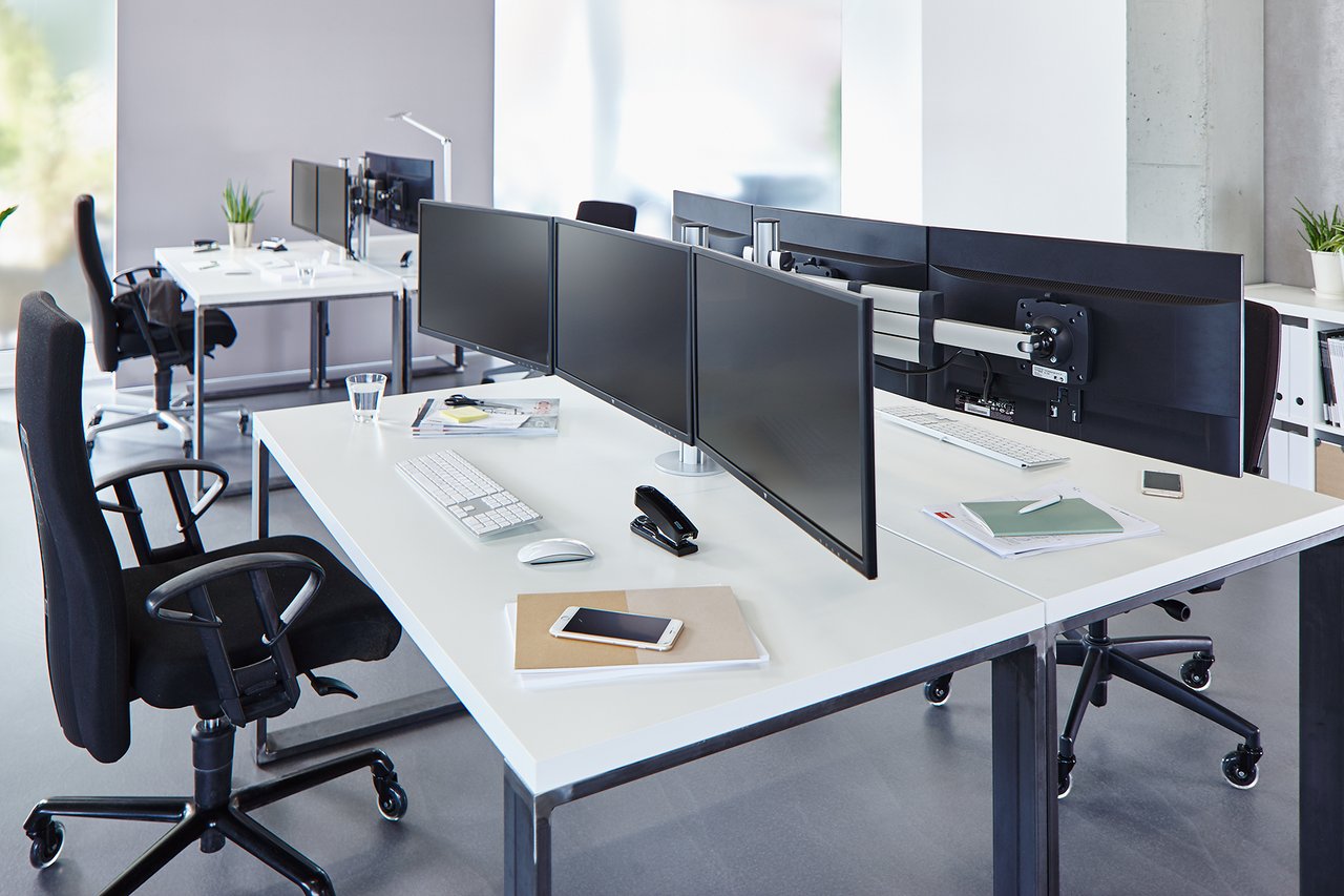 A pug dog wearing a yellow hat.