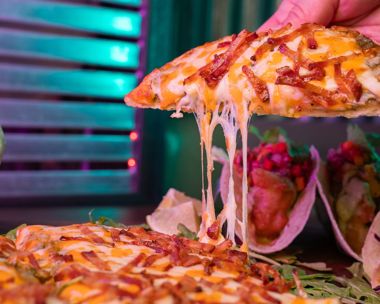 Cheese pull of our new bacon covered cheesy bread