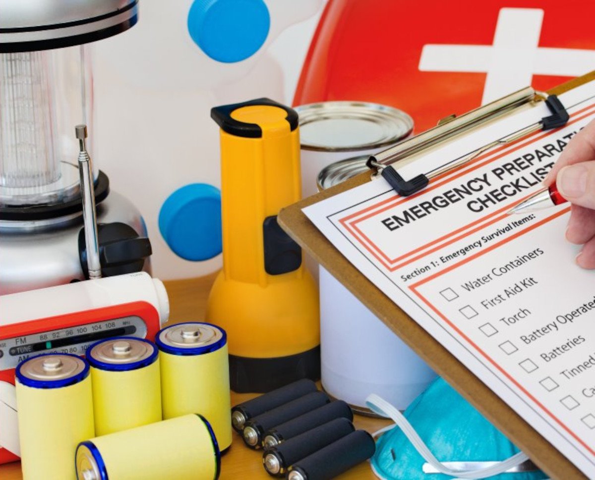 A checklist and pen with winter readiness supplies- Lantern, Flashlight, Batteries,  First Aid, and more