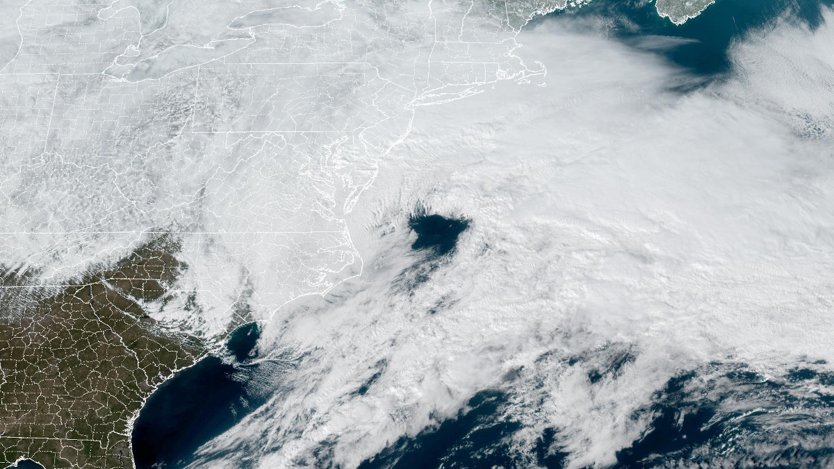 A developing nor'easter off the Mid-Atlantic coast will bring blizzard conditions to 56 million people beginning late February 22, 2026. NOAA GOES Satellite Imagery.
