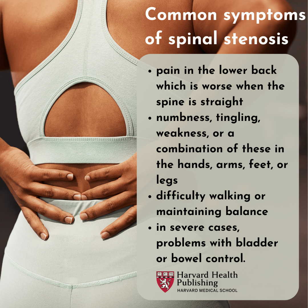 a woman holding her lower back as if she is in pain