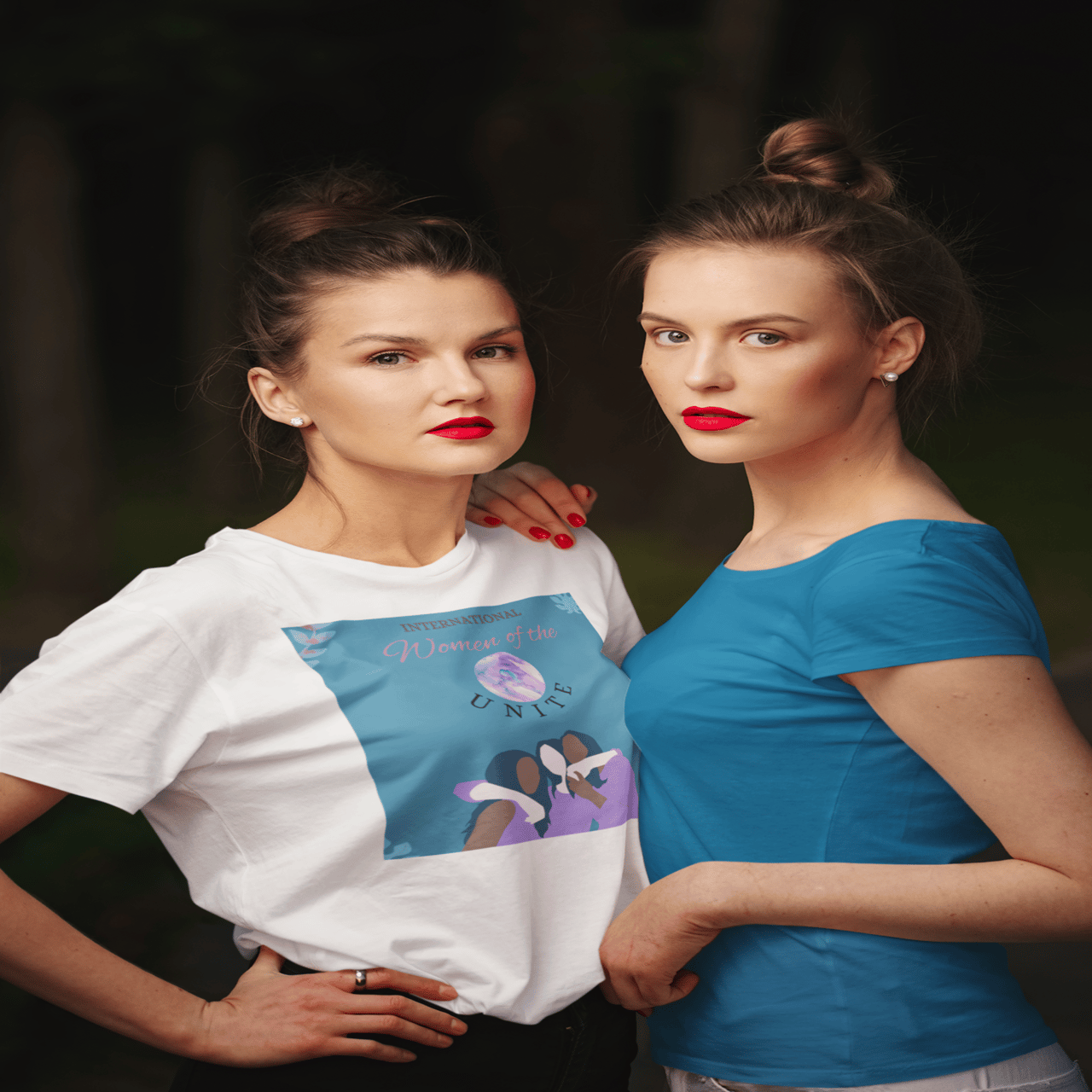 Two women wearing t-shirts and red lips.