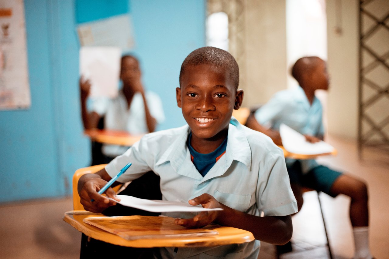 a young student sitting on a chair