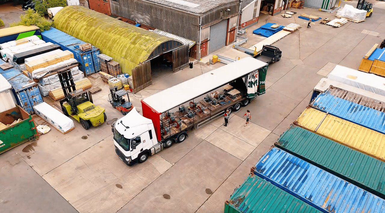 AN AERIAL IMAGE OF A LORRY IN A DISTRIBUTION CENTRE 