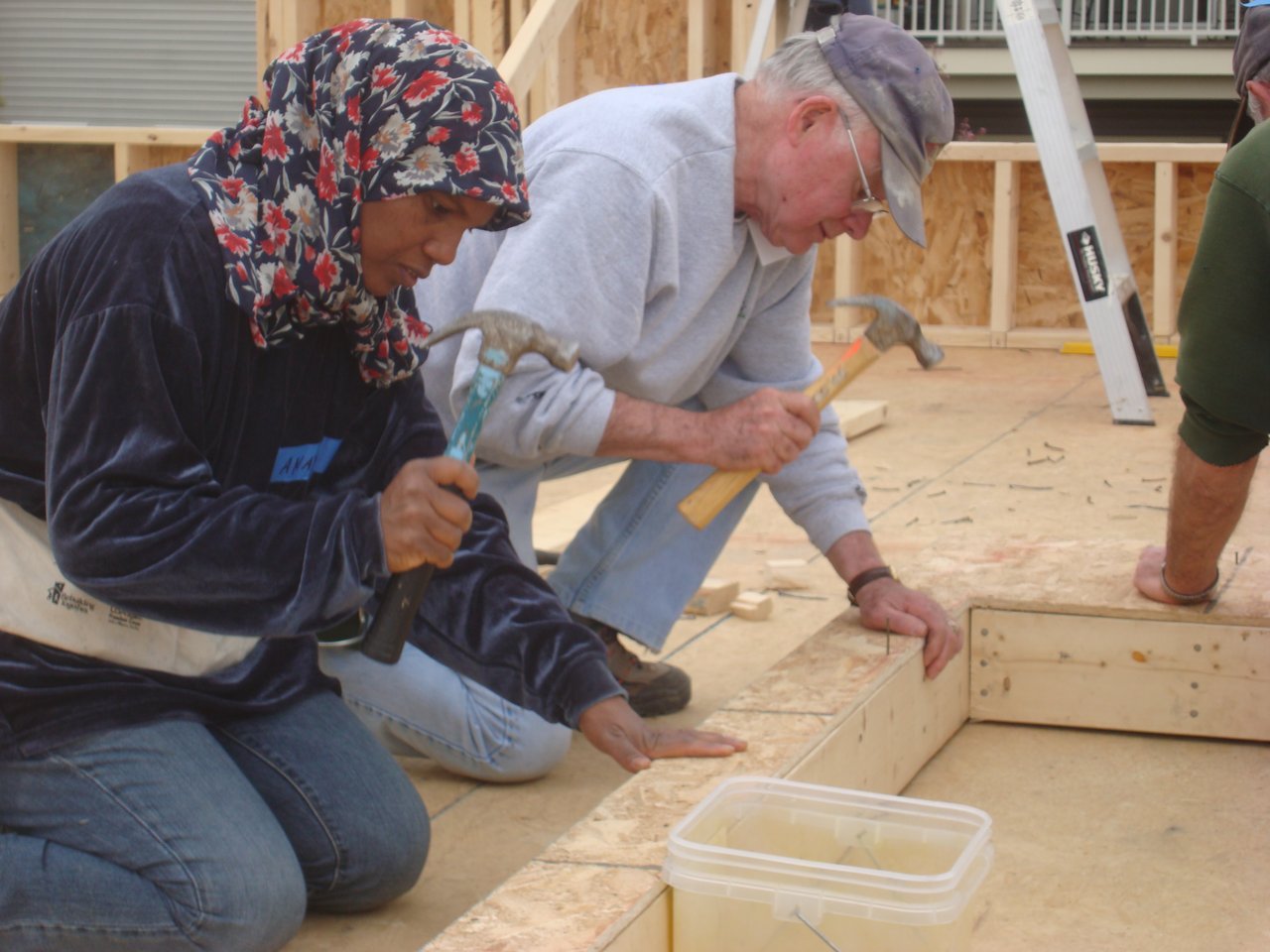volunteers building a home