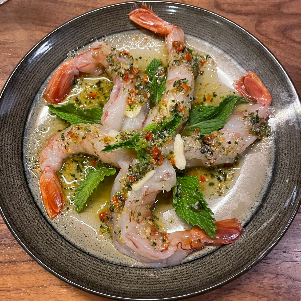 Kung Shae Nam Pla. Raw shrimp in fish sauce, chili, lime, and garlic. 