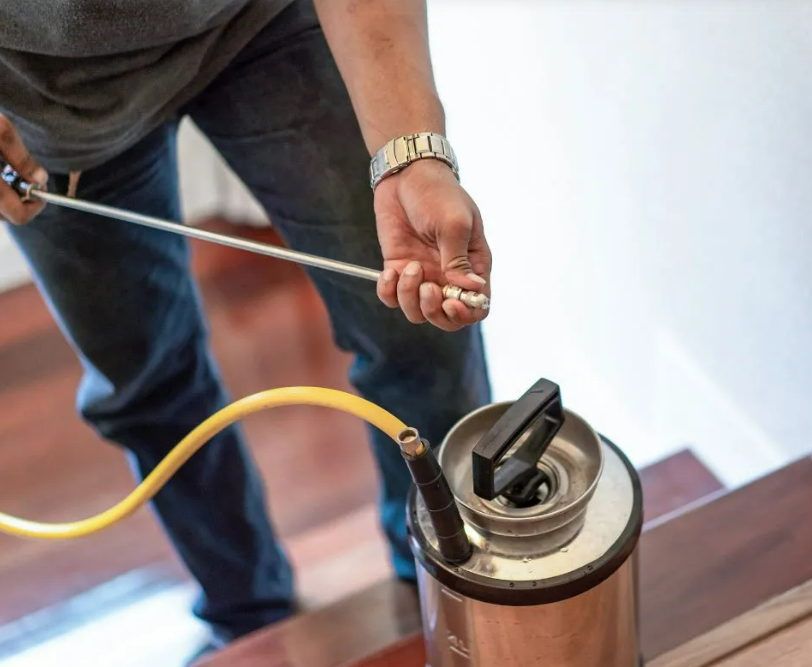 A pug dog wearing a yellow hat.