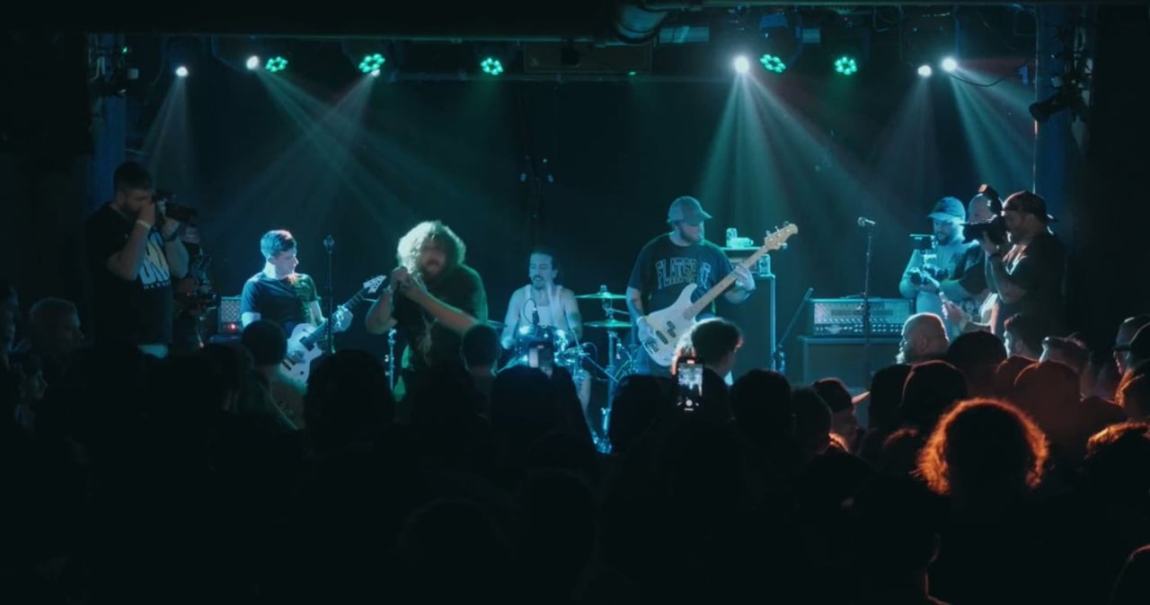 A pug dog wearing a yellow hat.