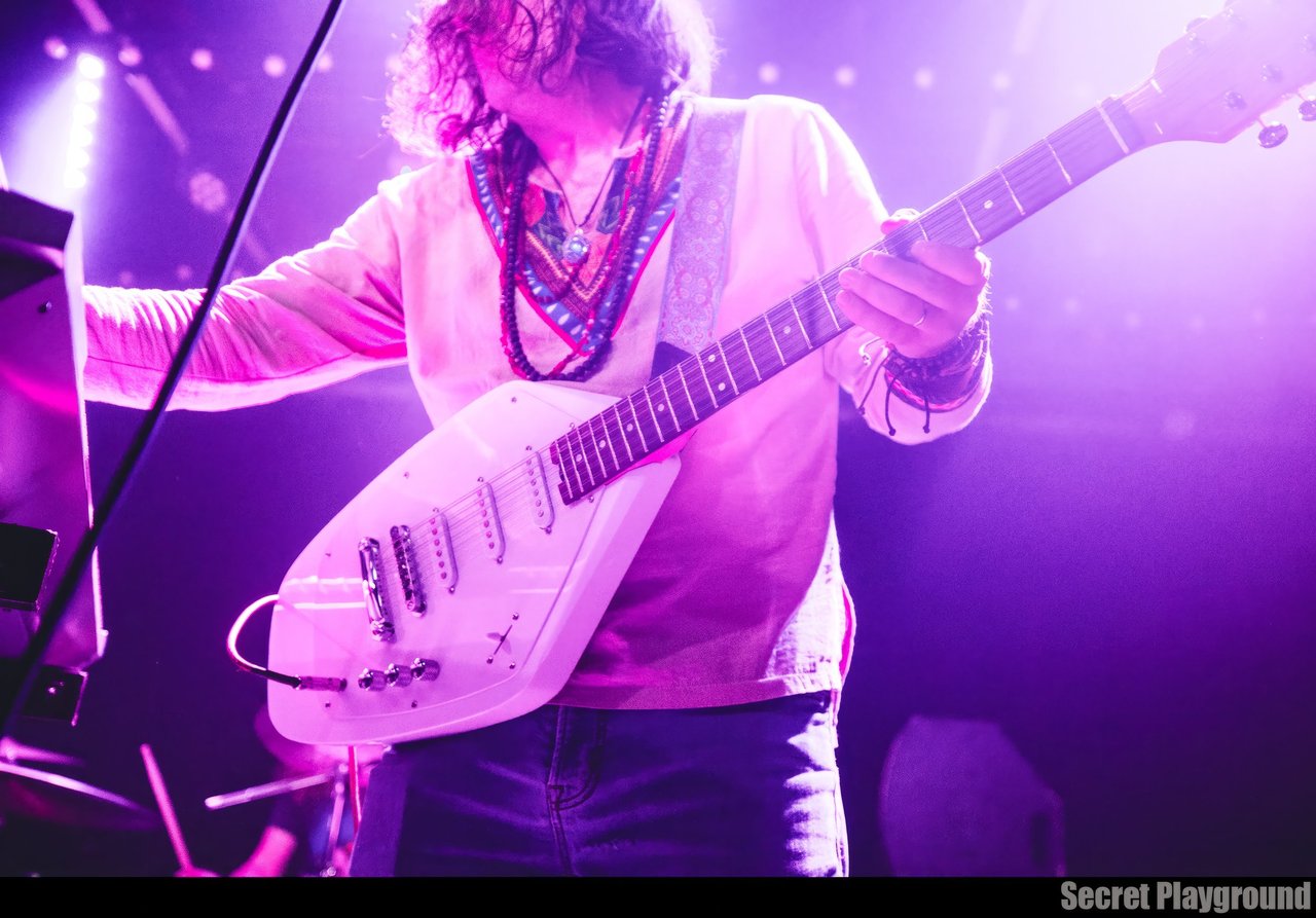Brad Leopard pictured with teardrop guitar