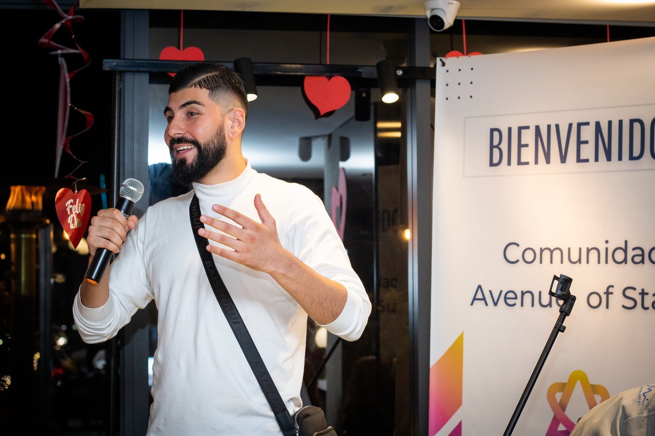 A cozy scene - a woman smiling with a blanket wrapped around her