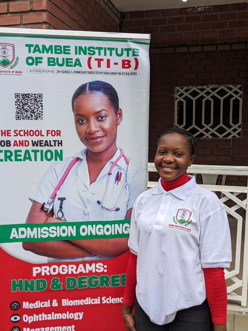 A student at Tambe Institute of Buea posing for the camera right on campus