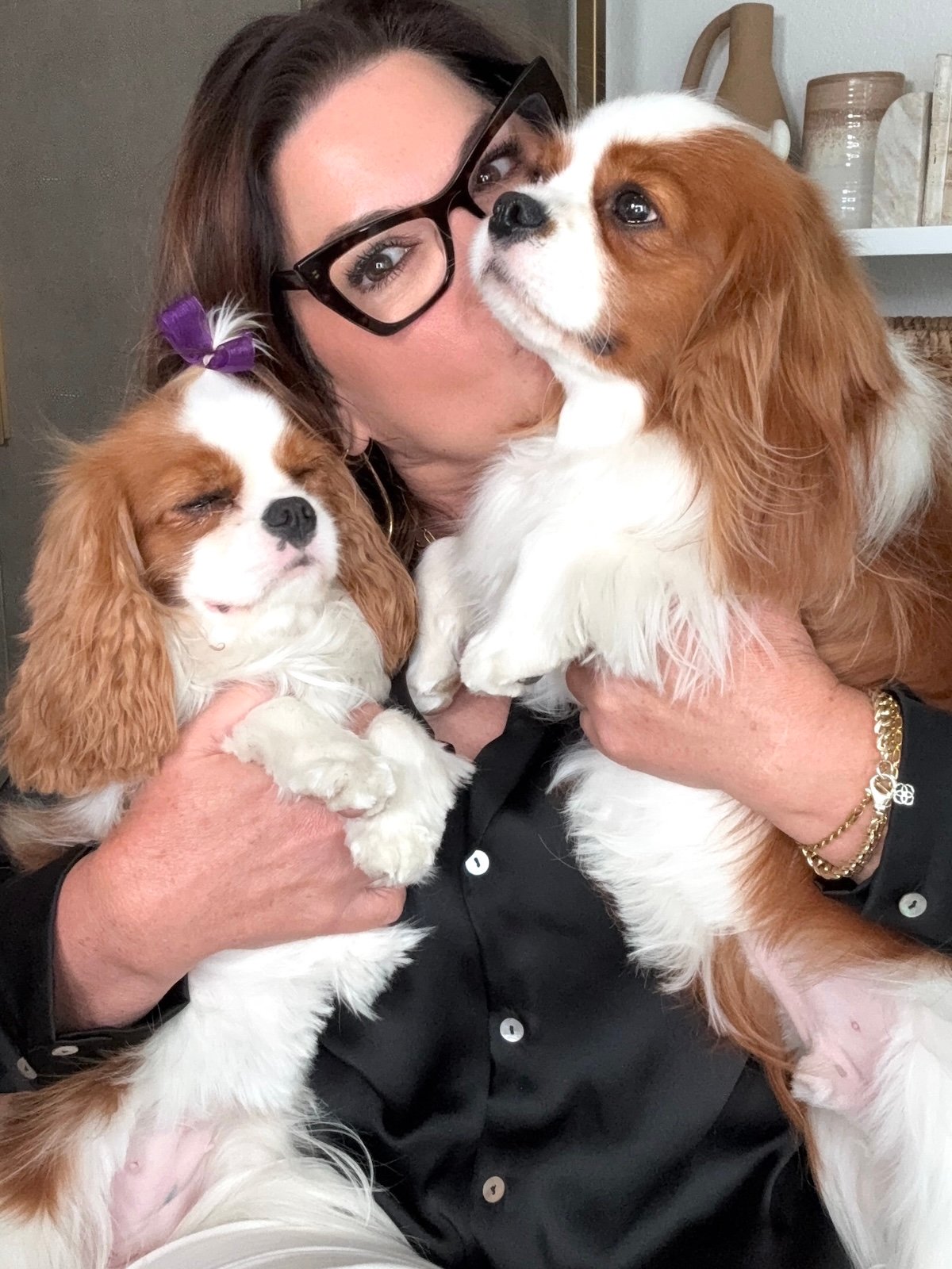 sonia roselli kissing her two cavaliers