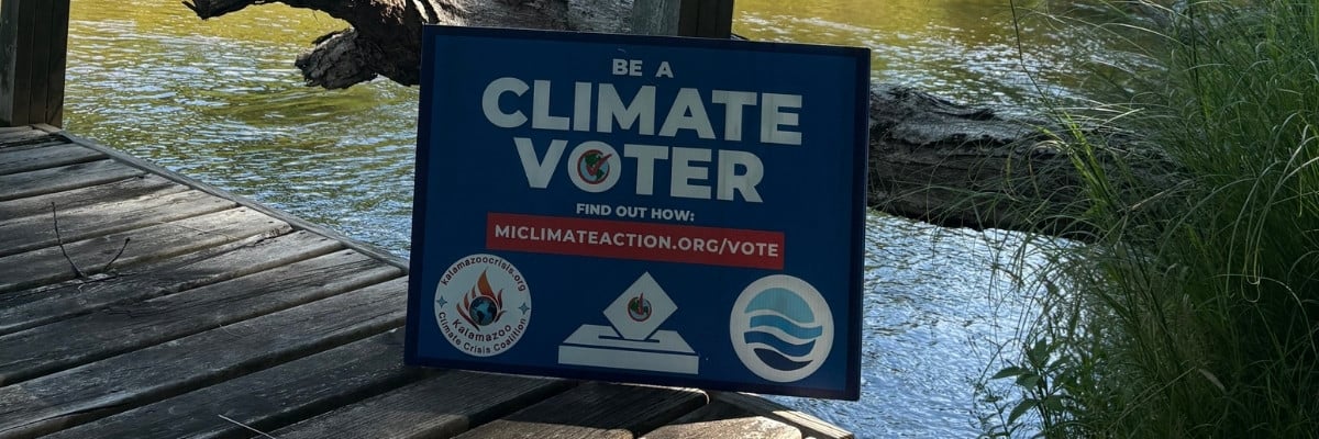 Climate yard sign on a beach on Lake Michigan.