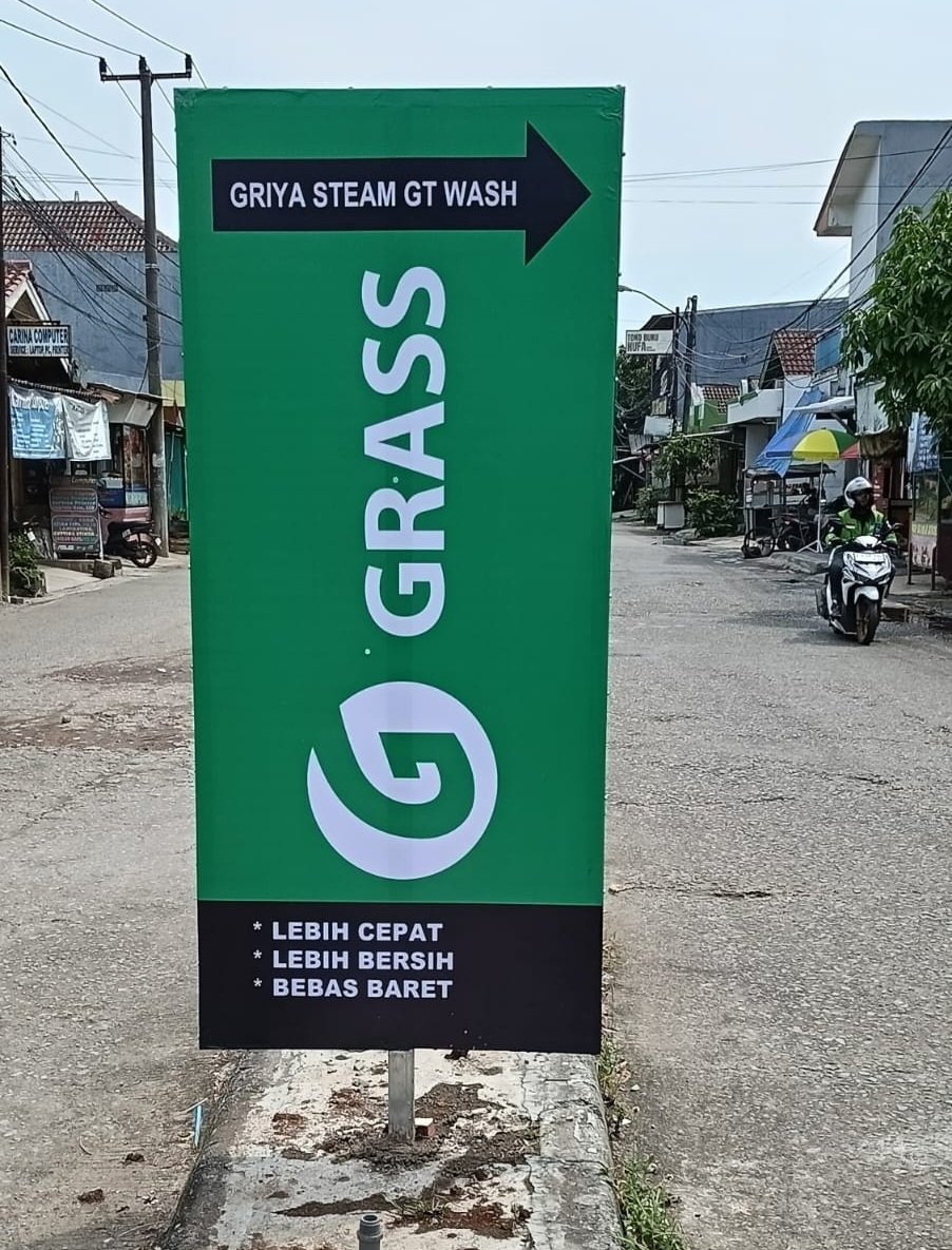 A pug dog wearing a yellow hat.