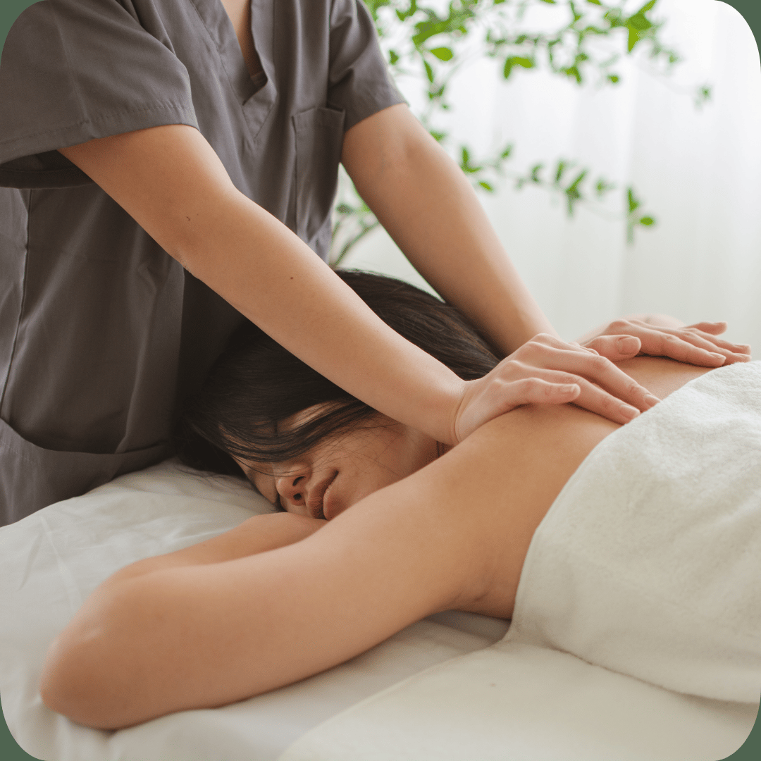 “A woman receiving a relaxing back massage at a spa, promoting comfort, wellness, and rejuvenation.”