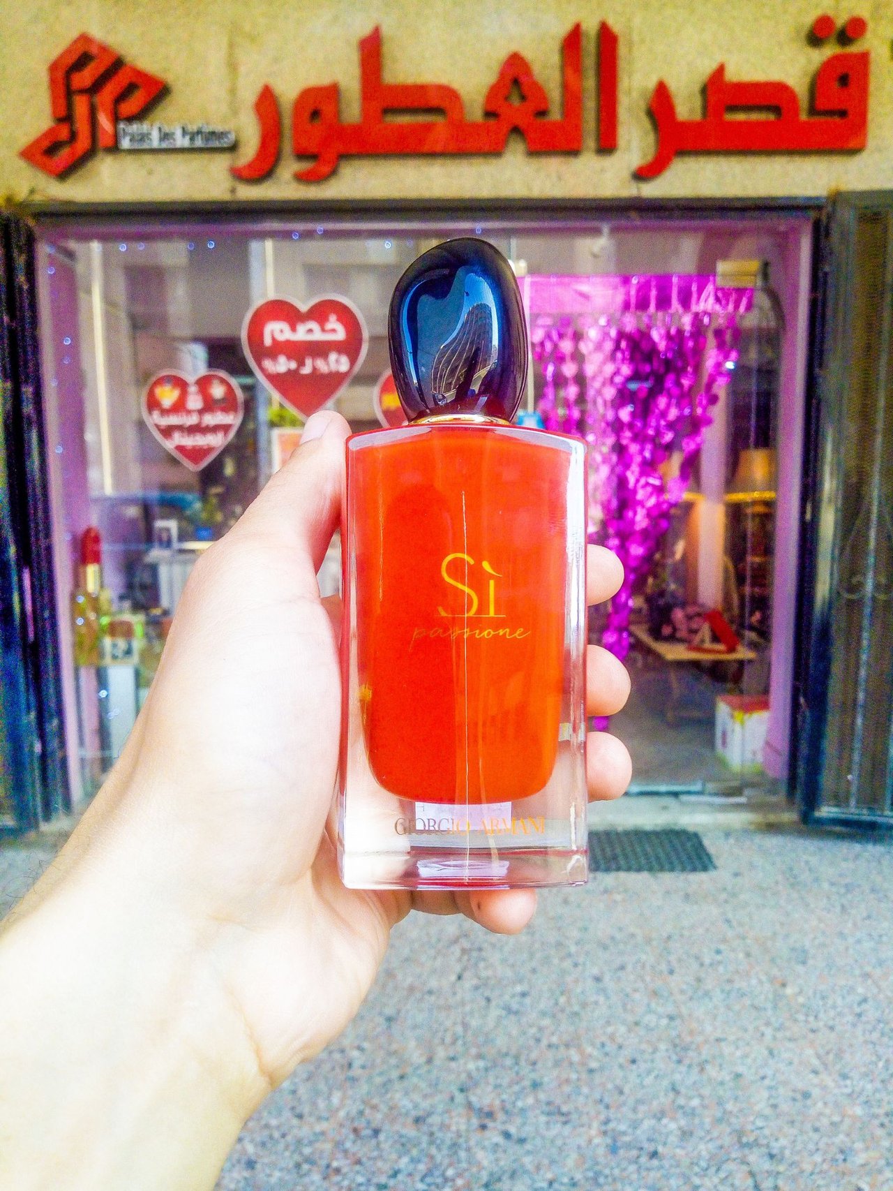 Original Giorgio Armani Sì Passione perfume bottle at Palais des Parfums Port Said, with Escada and Gucci boxes in the background at palais des parfums store قصر العطور ببورسعيد.