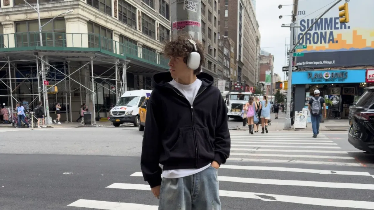 A pug dog wearing a yellow hat.