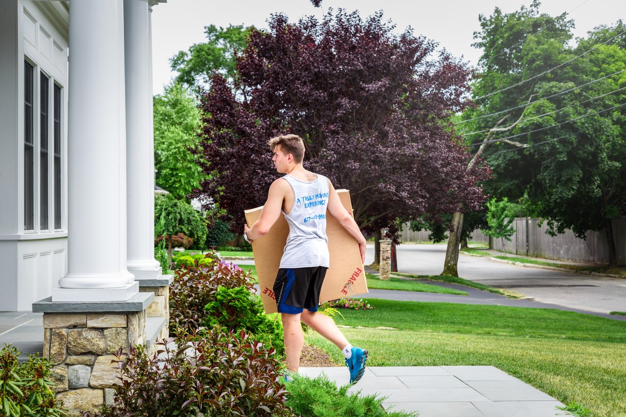 A pug dog wearing a yellow hat.