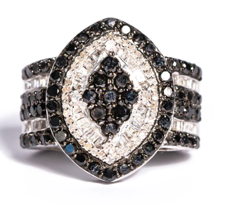 A pug dog wearing a yellow hat.