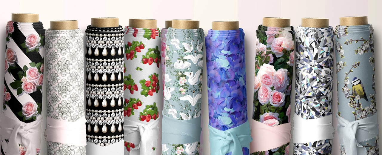 Little Gem Studio Fabric Designs by Emma Miller, founder of Kitty Love Shoes. 9 rolls of fabric, with hand drawn patterns by Emma, roses on diagonal stripes, gems, pearls, strawberries, swans, roses and foliage, diamonds and great tits on blossom branches