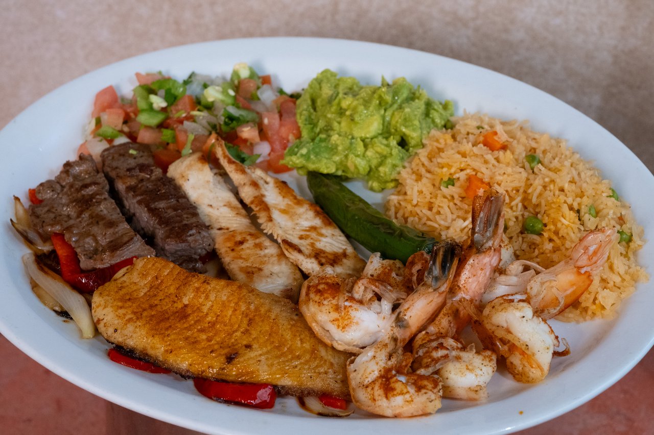 Array of grilled shrimp, catfish, beef fajita, and chicken