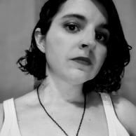 A young woman with brown hair and brown eyes 