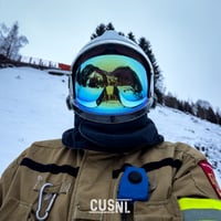 GearHead with an firefigher helmet in the snow