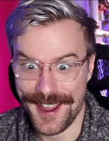 Missildine making a POG face and looking excited with glasses and a mustache