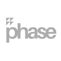 Alexoo pictured from the shoulders up under neon blue and organge lights. They wear a pair of black sunglasses