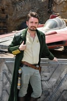 Me, dashing and handsome, standing in front of an X-wing.
